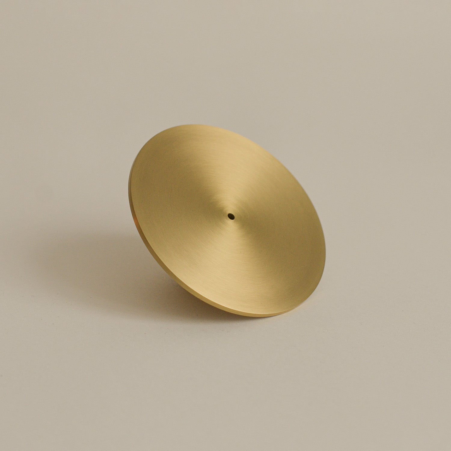 The front view of a brass incense holder