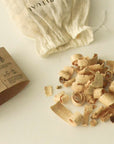 palo santo bath flakes with sleeve and mesh bag