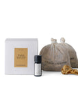 Cedar and Myrrh Palo Santo Bath Flake and Essential Oil Ritual Set featuring two bags of Palo Santo woodBath  flakes, one bottle of pure essential oil, and minimalist white packaging