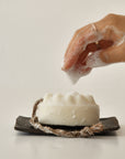 palo santo bar soap with bubbles on the plate