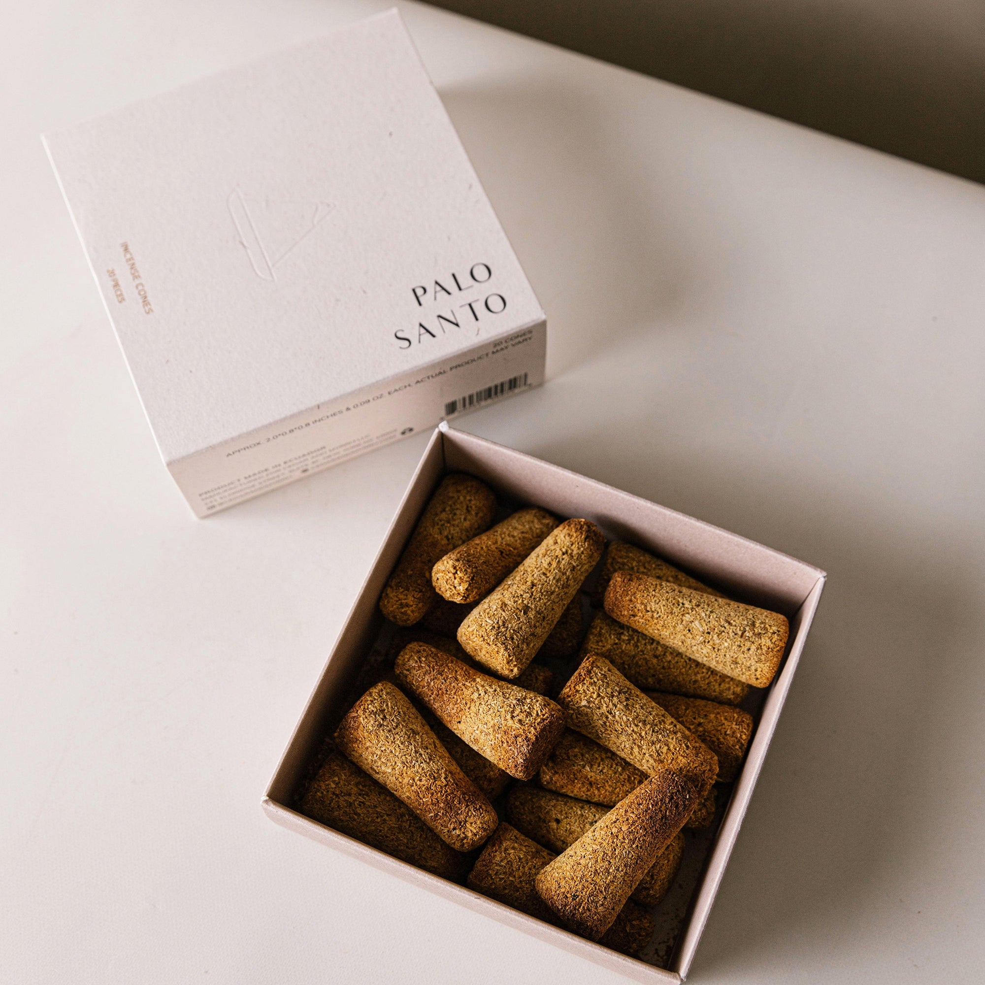 several pieces of palo santo incense cones in a box
