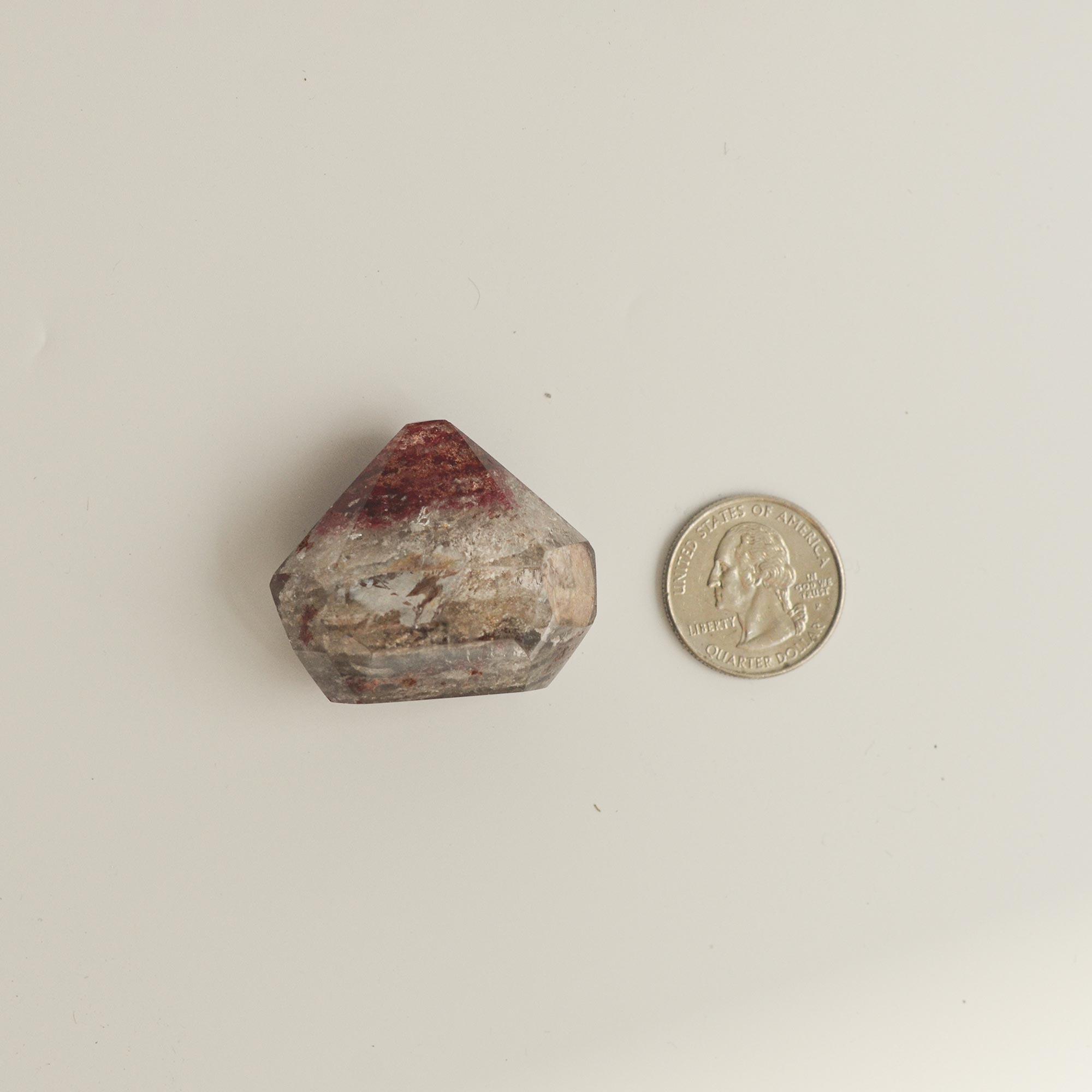 phantom quartz crystal and quarter dollar coin