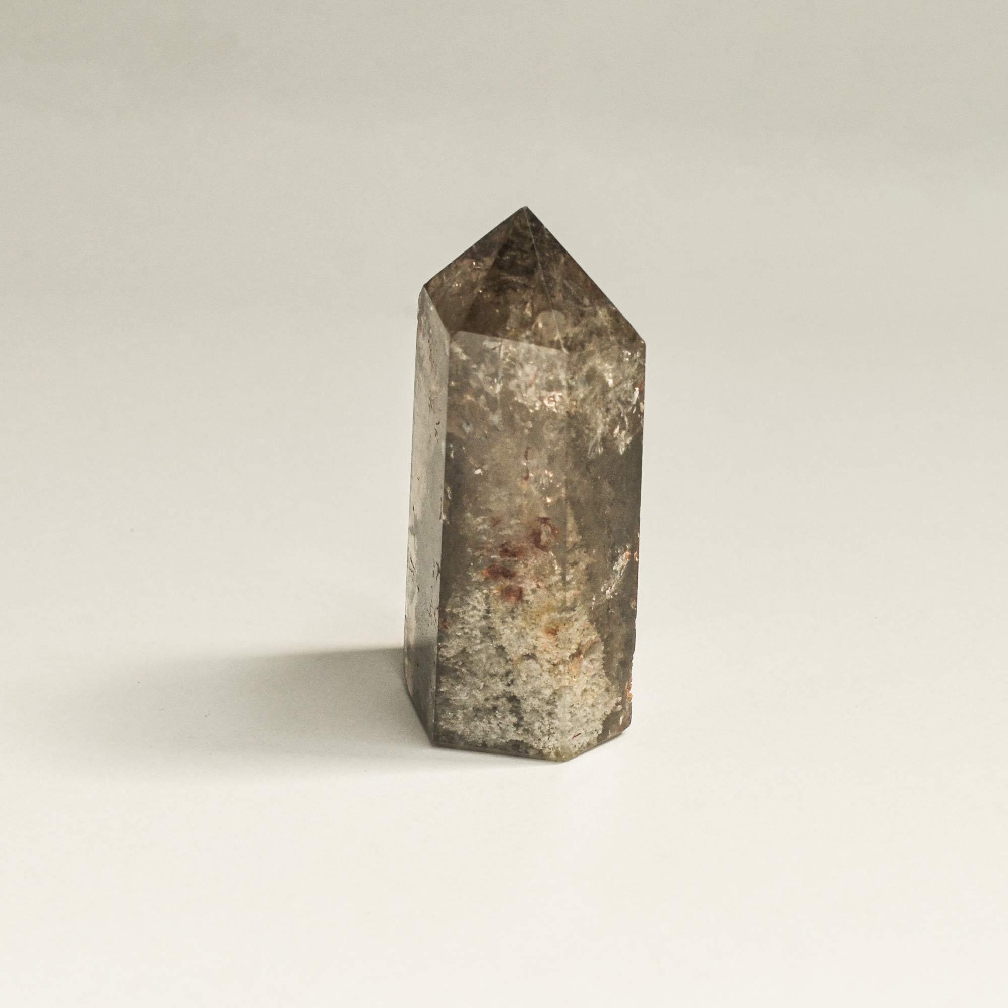 The side view of the phantom quartz crystal tower in brown hexagonal shape