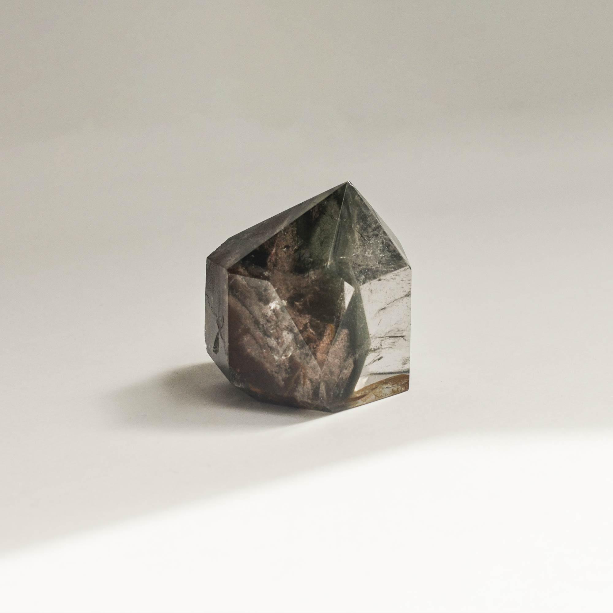 side version of short hematite phantom quartz crystal