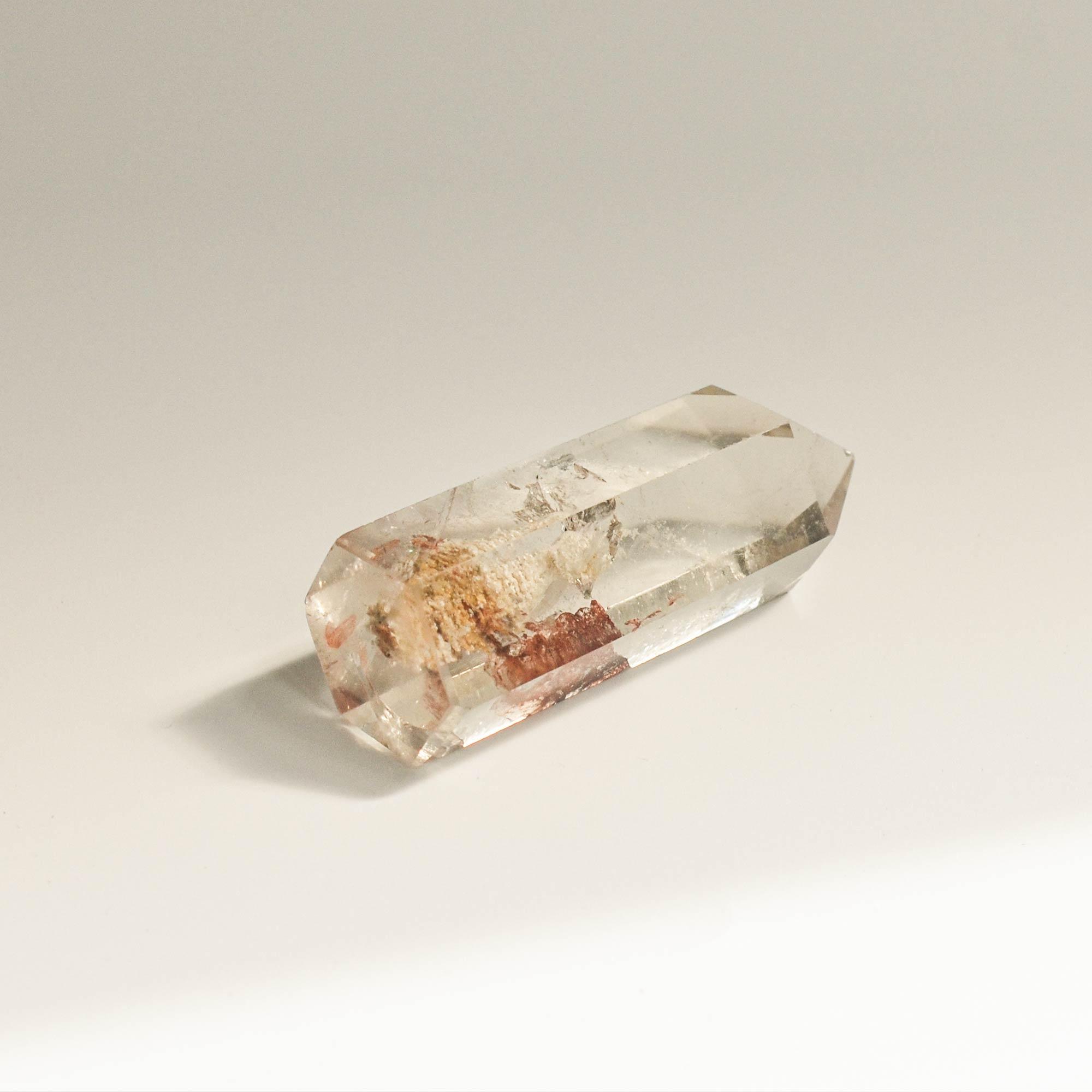 rear view of transparent phantom quartz with reddish pattern