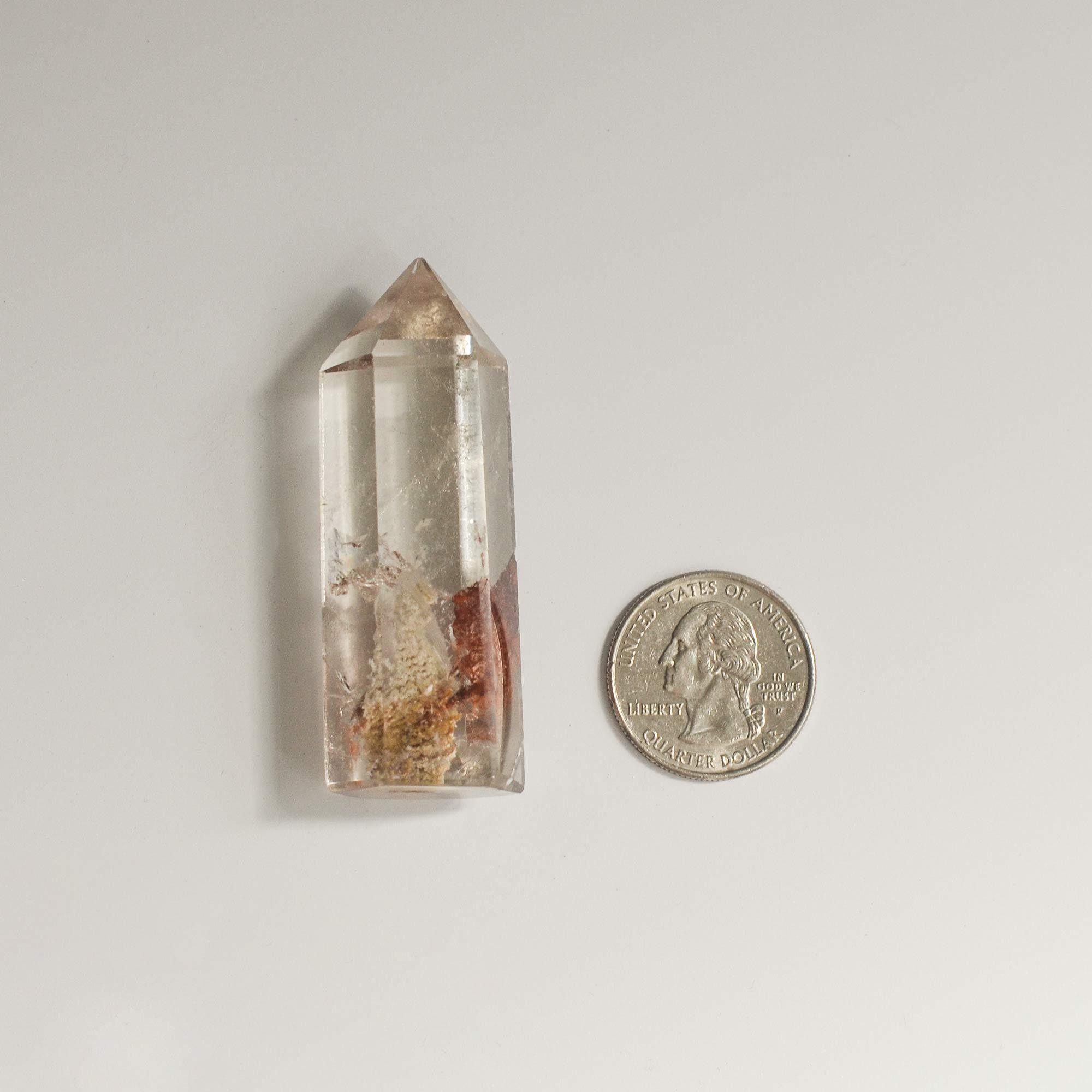 long transparent phantom quartz and quarter dollar coin