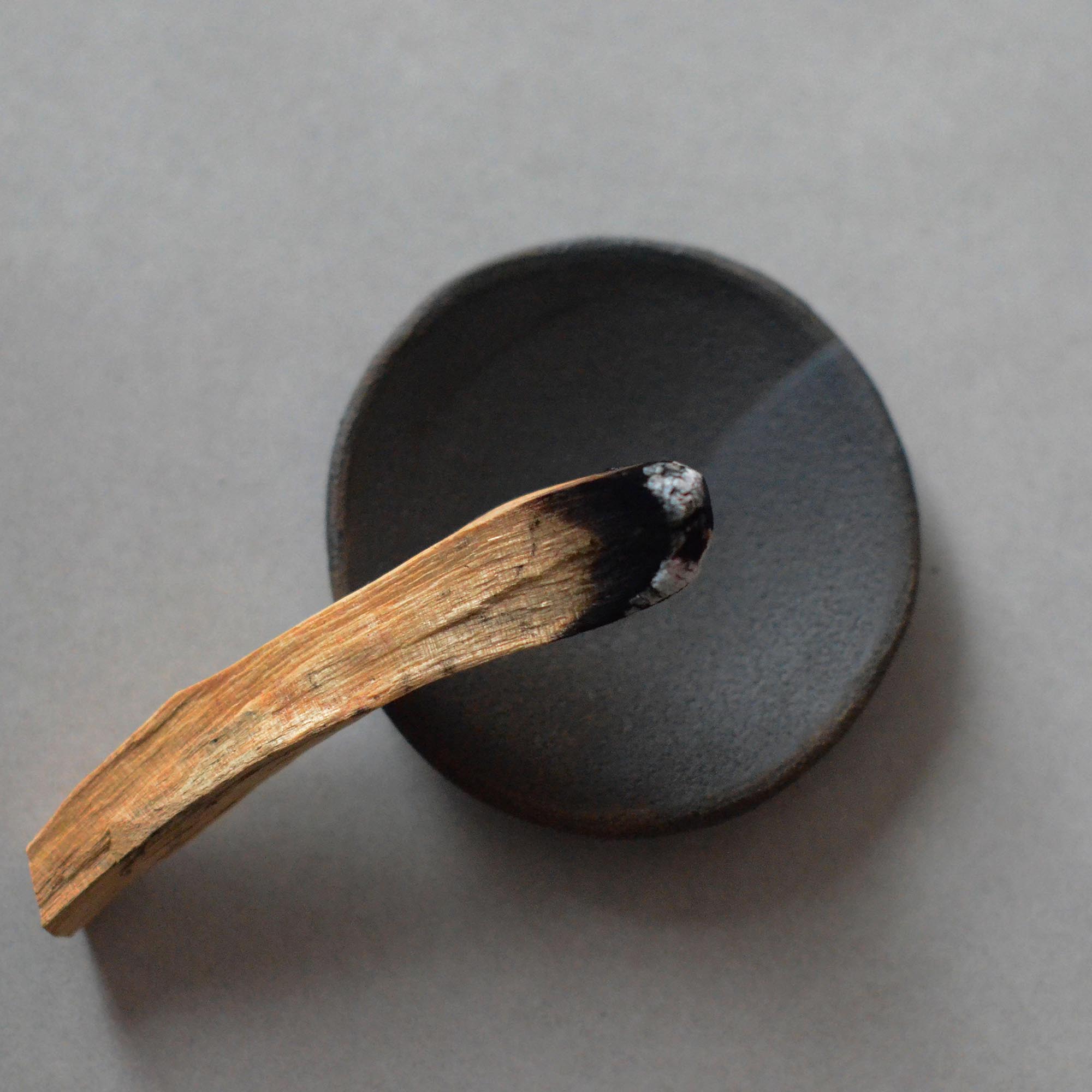 wood incense stick and a plate for incense