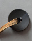 wood incense stick and a plate for incense