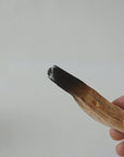 Showing how to smudge stick wood.