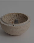 Smudging incense cone inside travertine sphere smudging burner