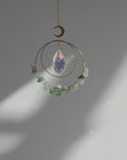aventurine crystal suncatcher with light reflection and rainbows