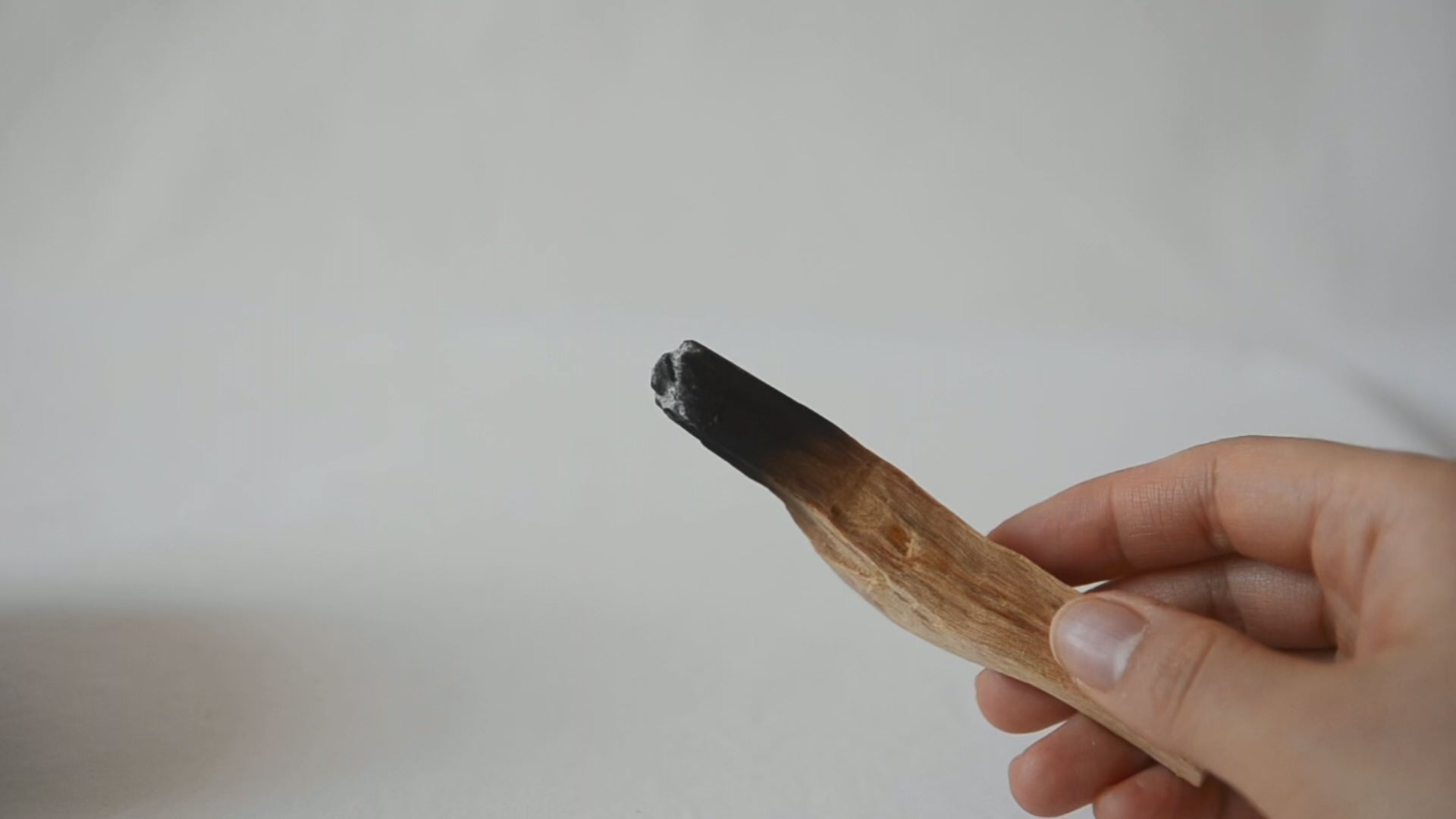 Showing how to smudge wood stick.
