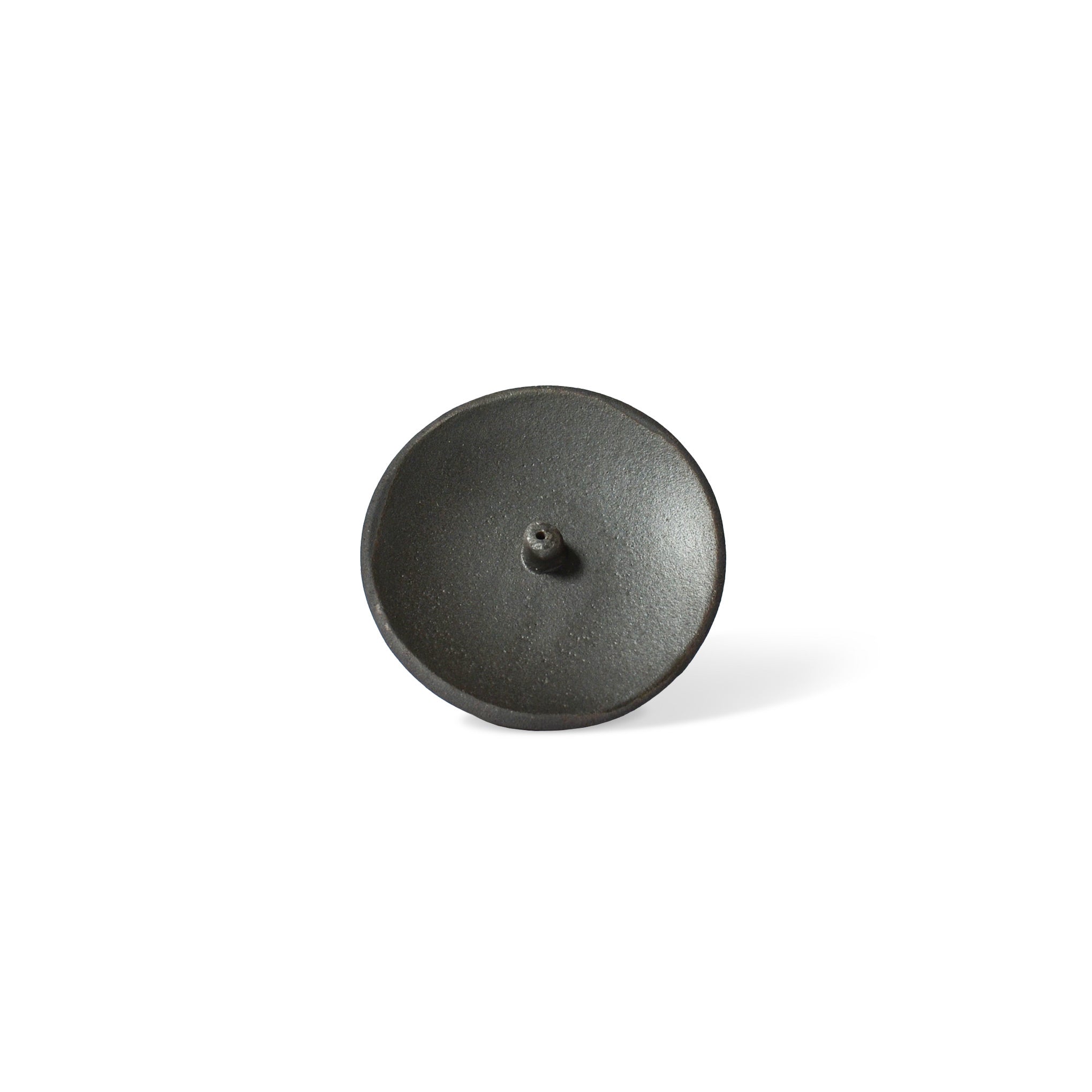 a raw black clay incense holder