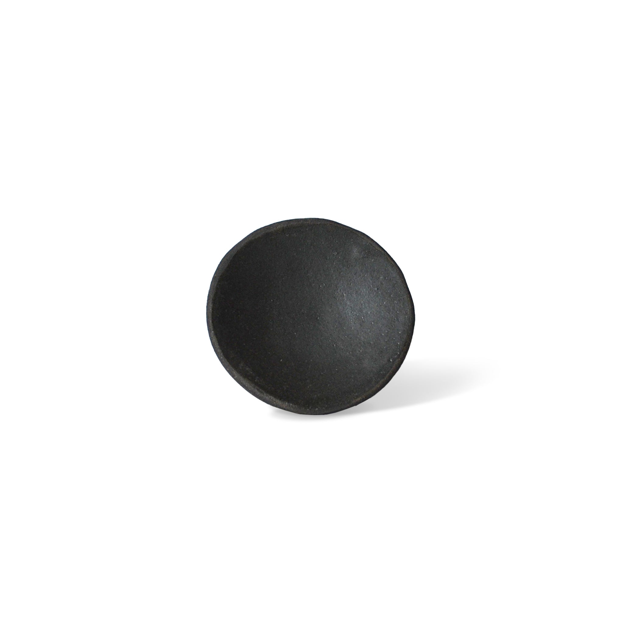a raw black clay plate for incense