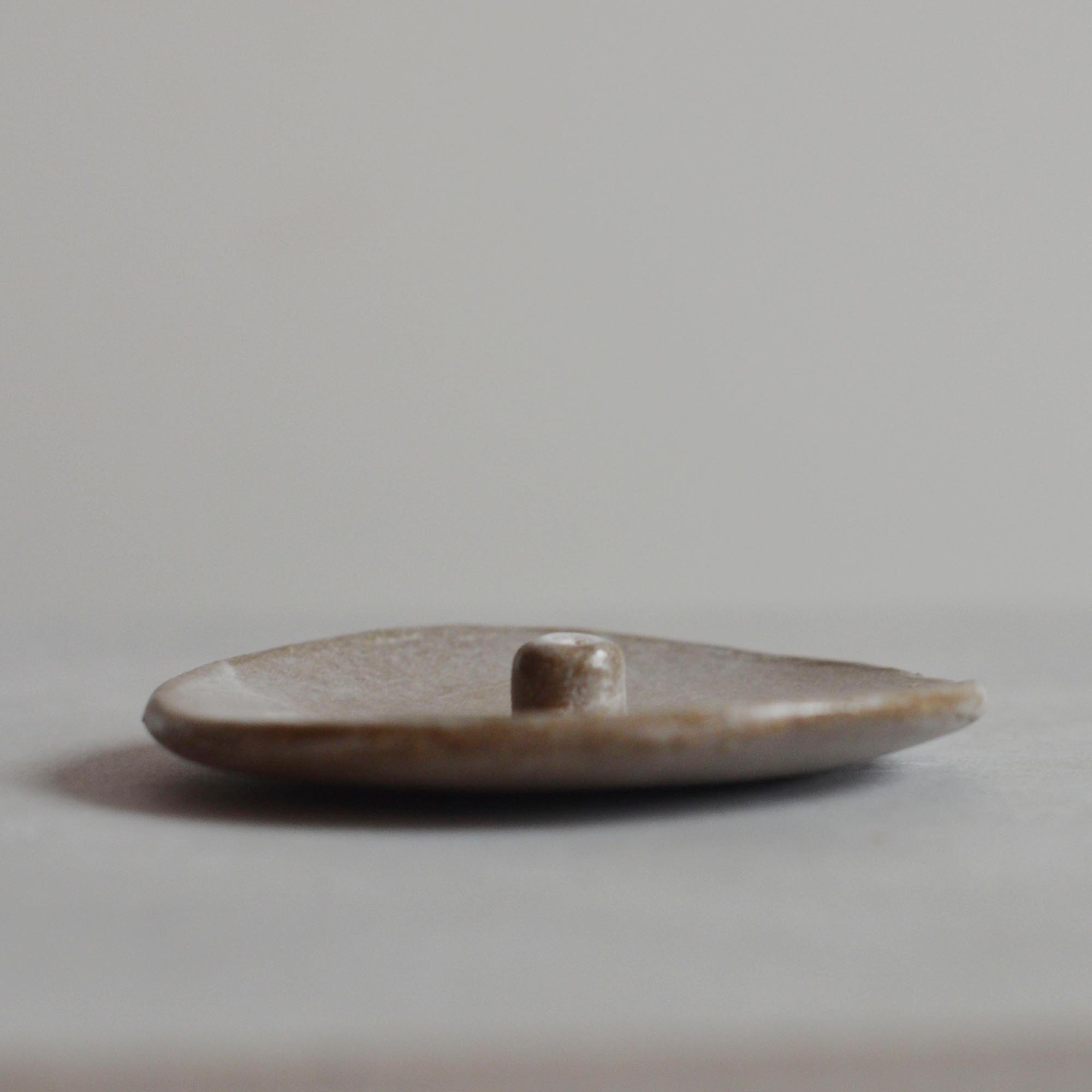 a sand ceramic incense holder