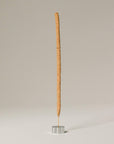 palo santo incense stick with polished silver incense holder