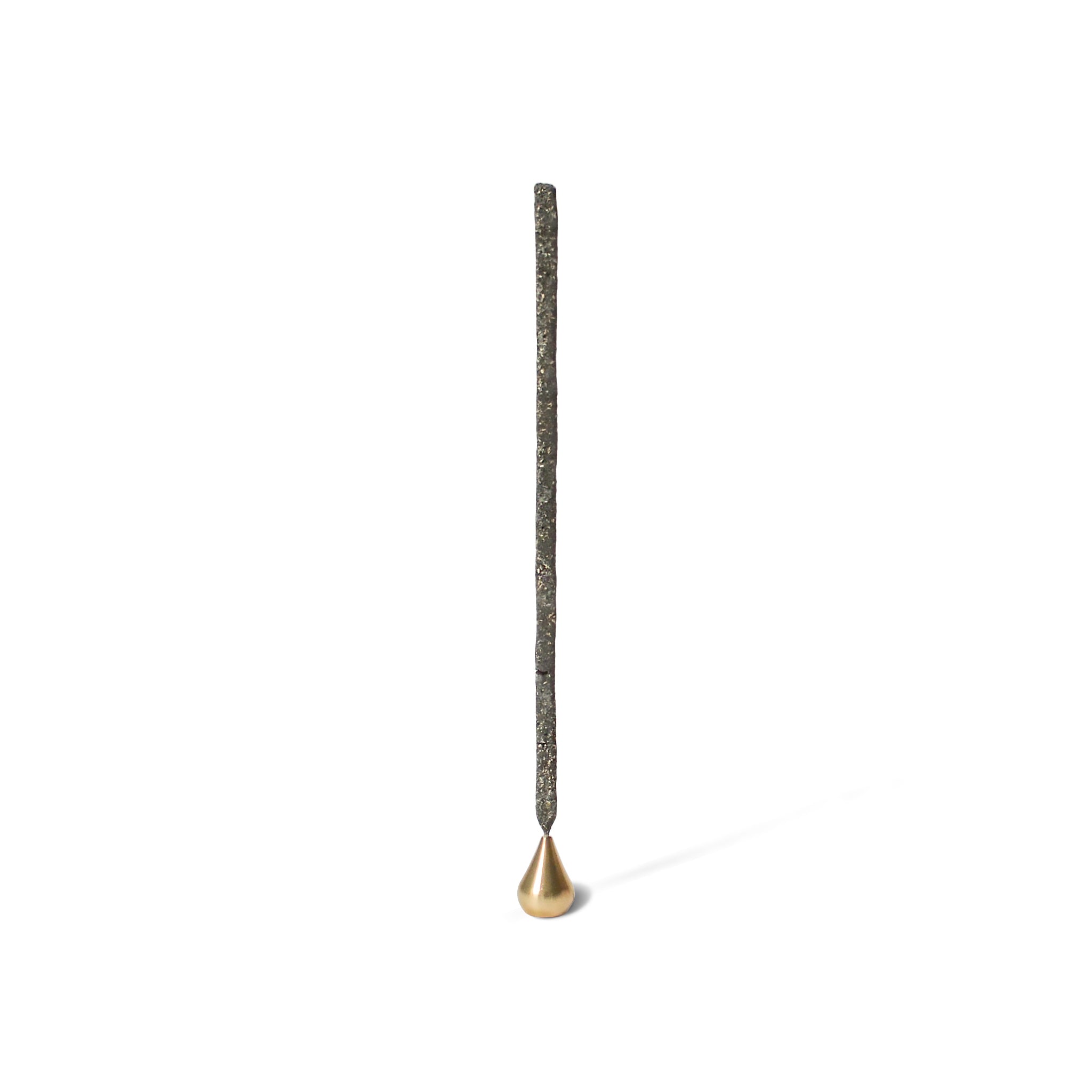 copal incense stick with incense holder with a tall brass waterdrop