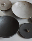 several incense bowls and holders made of ceramic