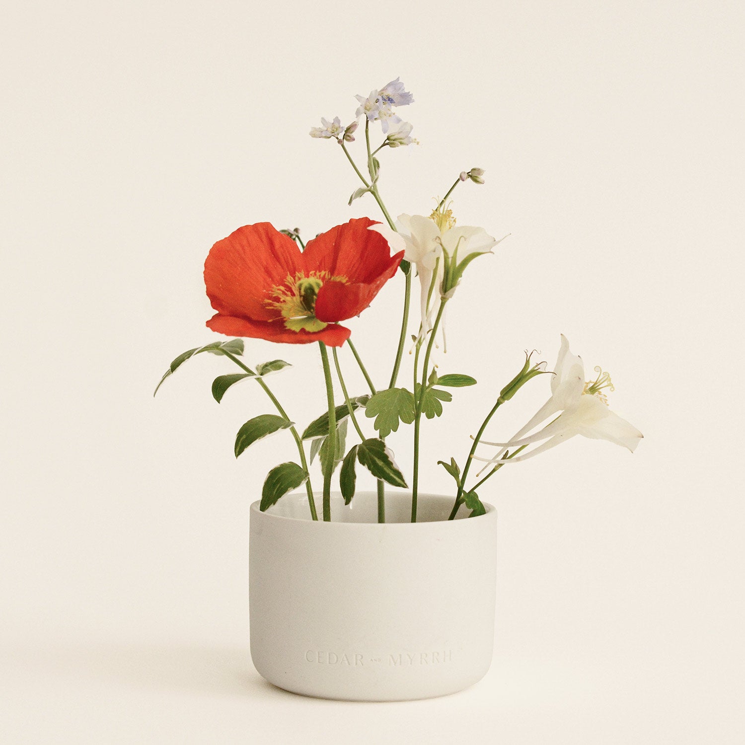 Floral arrangement in a white vase made of ceramic