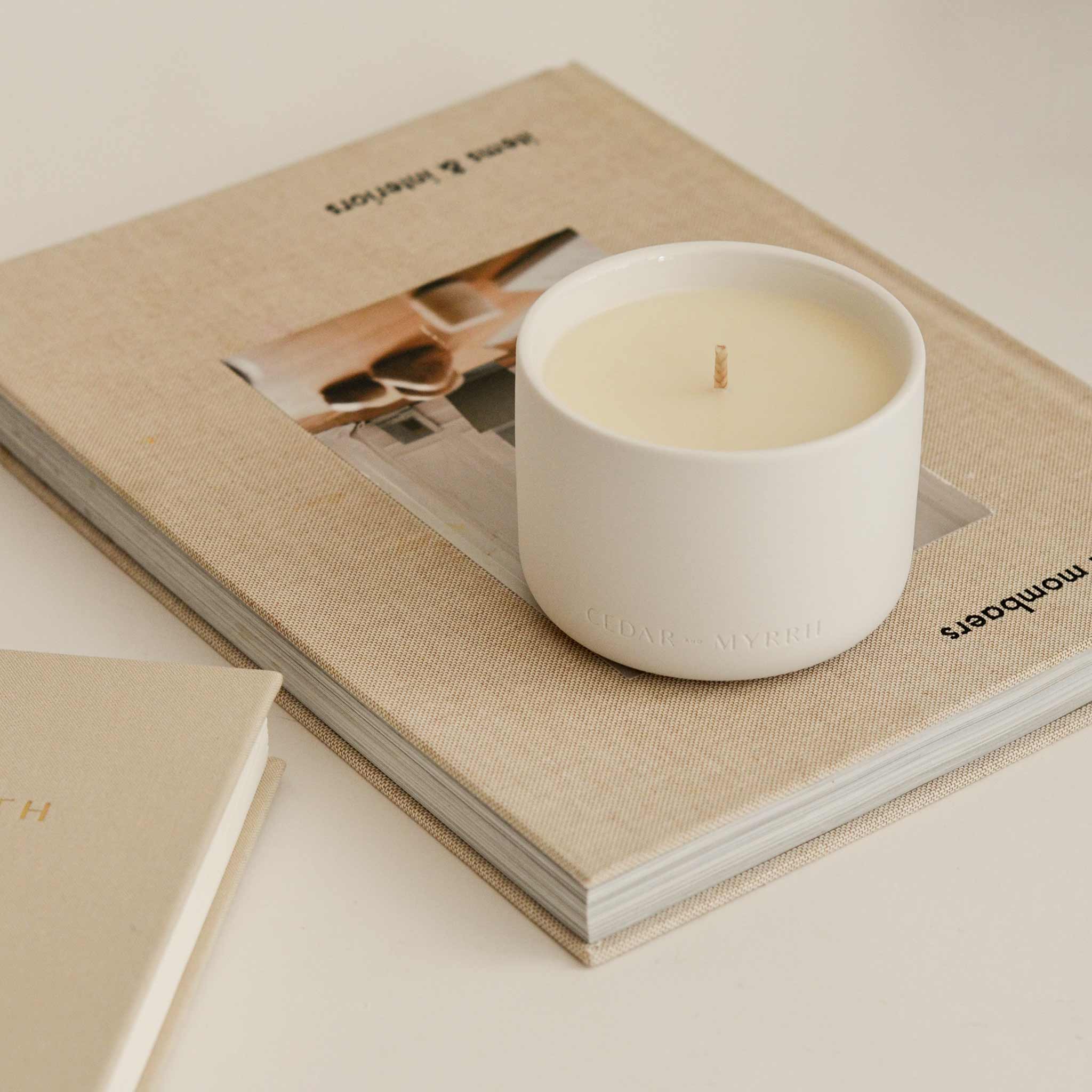 wellness candle on the book