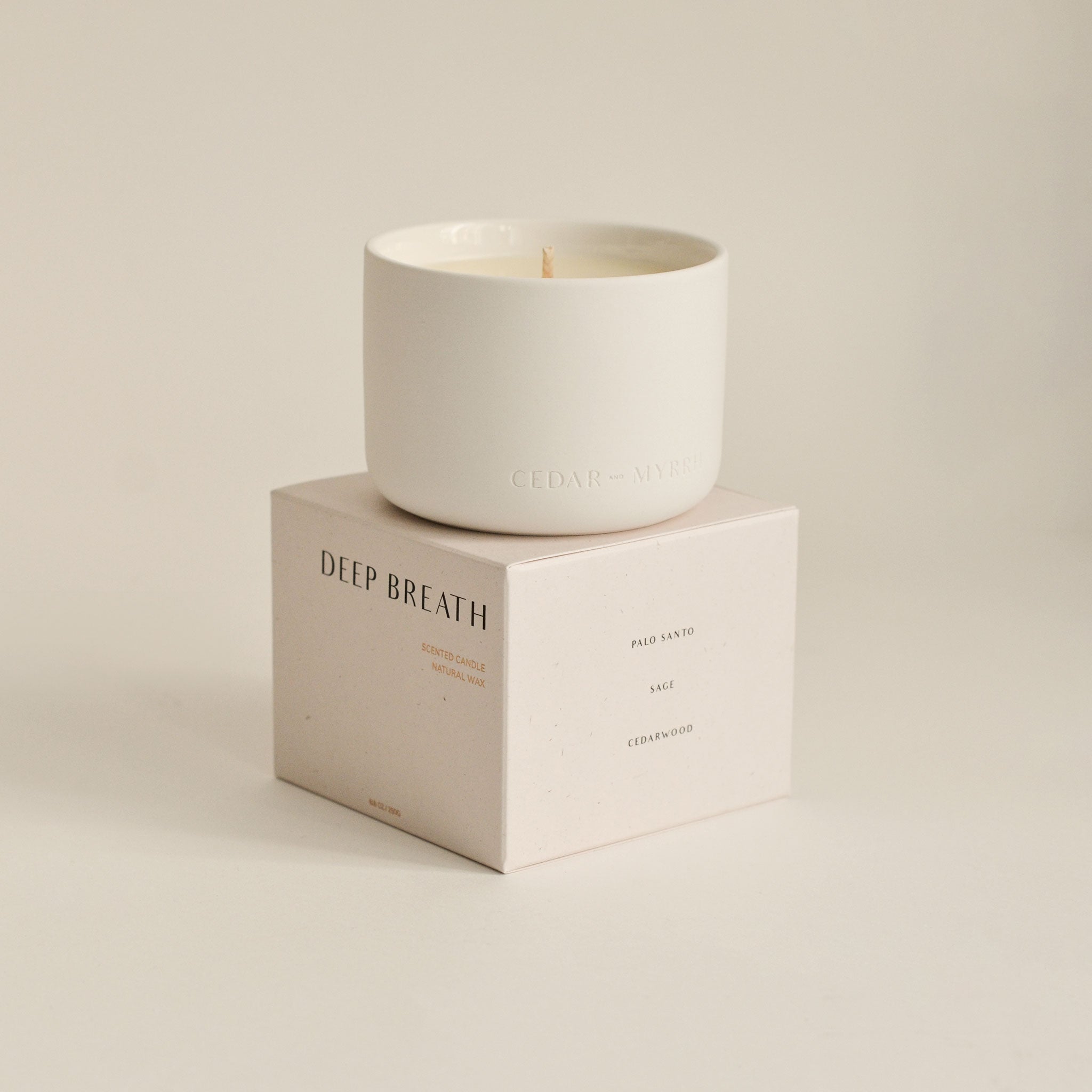 Candle with packaging labeled 'DEEP BREATH'